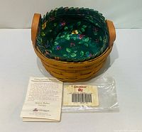 Basket with liner, booklet and plastic bag displayed
