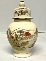Front view showing floral and quail design with lid on