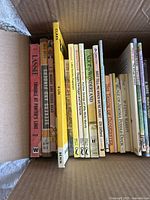 Top view of the box showing approximately 20 children's books, arranged upright, titles visible on spines.