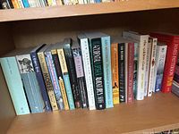 Shelf of 15 books showing various titles and authors including James Joyce, Colin Dexter, Agatha Christie, and James Patterson.