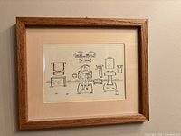 Frontal view of the framed cartoon bathroom print showing the artwork, mat, and wood frame.