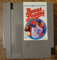 NES game cartridge Bases Loaded by Jaleco showing label with baseball player