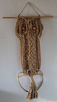 Full view of the large vintage macrame owl wall hanging from front