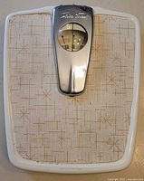 Full top view of the vintage Stilava trim scale showing the patterned surface and chrome dial housing