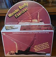 Front view of the Wonder Body Exerciser box showing the name and exercise pose with resistance bands