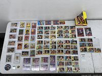 Overview of entire lot on table showing cards, pins, wax box