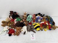 Wide shot showing entire assortment of approximately 45 Ty Beanie Babies