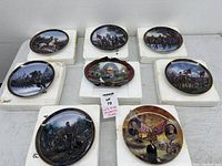 Top view of eight Civil War plates on table