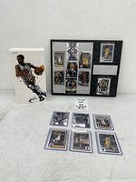 Overall view showing plaque, sealed box and eight loose cards