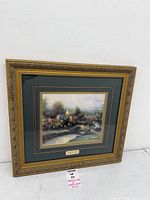 Full view of framed Lamplight Village canvas
