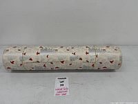 Full view of large roll showing cardinal and tree pattern