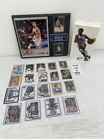 All items together: plaque, boxed figure, array of basketball cards