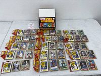 Overview of display box and all sealed rack packs spread out