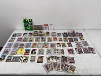 Overview of table with entire assortment of football cards and stacks