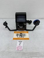 Complete lot showing editor viewer with reel arms, power cord, and manual