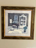 Full view of the framed wall art print showing the bathroom scene inside an ornate gold wood frame.