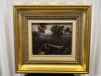 Frontal view of the antique oil painting in a gold gilt frame showing the entire artwork and frame condition.