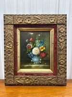 Full view of antique oil painting in carved gilt wooden frame with red velvet matting, showing minor wear.
