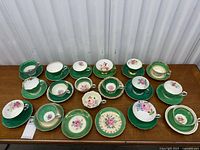 Overall view showing all teacups and saucers arranged in two rows
