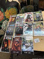 overview of all 11 bagged comics laid out on table