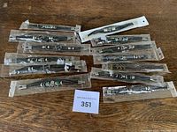 All 13 packaged bracelets laid out on table