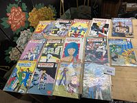 All 14 bagged Robotech comic books laid out