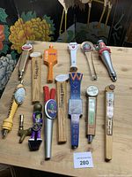 All 14 tap handles laid out on table