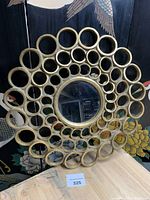Front view of round honeycomb mirror showing full design and central mirror