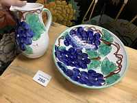 Pitcher and bowl together on table showing overall design and size reference