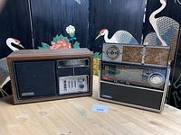 Two radios side by side on table