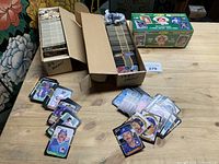 Overview of two open storage boxes with loose Donruss cards and one sealed 1991 Score box