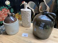 Overview of three pottery pieces on table