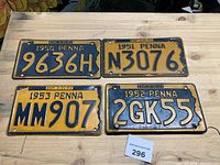 All four Pennsylvania license plates on table