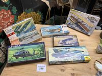 All seven boxed kits grouped on tabletop