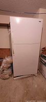 Exterior view of the white large upright freezer showing the closed single door with handle