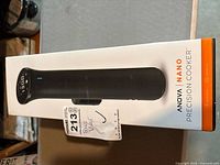 Box of Anova Nano Sous Vide Precision Cooker with photo of the product on the side showing model name and branding.