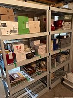 Full view of the four-tier plastic shelving unit with no contents included, showing the shelving design and dimensions.