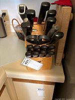 Wooden knife block with multiple knives and sharpening steel