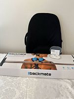 Obus Form backrest with Backmate Pain Relief Bar box and HoMedics pain relief pad on table