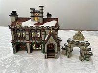 Front view of the porcelain building and archway on white background