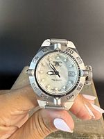 Front view of Invicta wristwatch showing dial, hands, date window and bezel details.