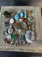 Tray with all silver and stone jewelry pieces displayed