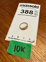 Photo of the small 10K gold ring on auction card with size and lot details visible.
