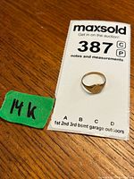 Ring displayed on auction card labeled 387 with green '14K' tag