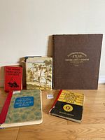 Overview photo of the five vintage and antique books showing front covers and general condition