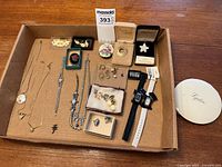 Box containing all vintage and costume jewelry items and watches, providing overview of lot contents