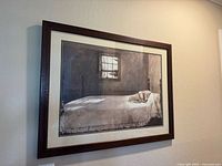 Framed Andrew Wyeth print from a distance, showing entire framed artwork hung on wall