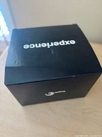 Box of Seagate external hard drive showing black packaging with 'experience' text.