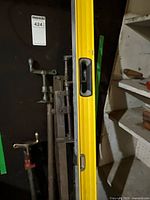 Yellow box level beside two long clamps