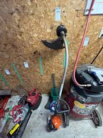 Echo GT-225 trimmer, Weed Eater hedge trimmer, debris shield visible